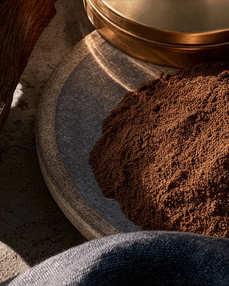 A mound of roasted mesquite powder on a stone disc